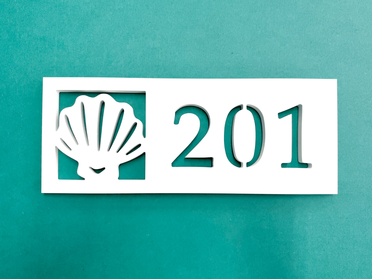 coastal house number sign with seashell beach shell