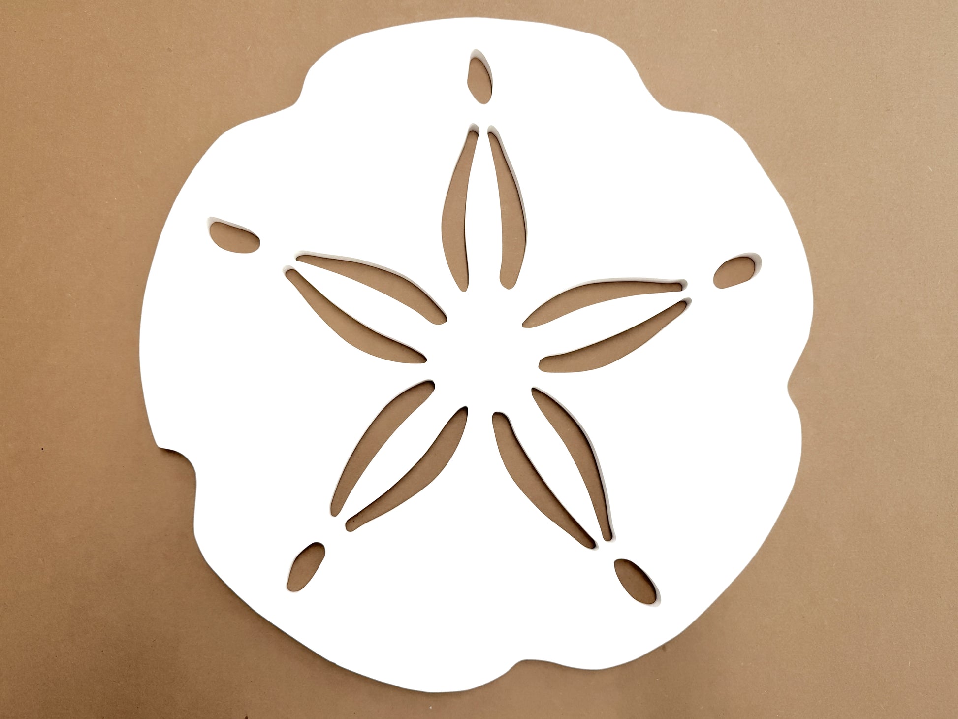 large outdoor sand dollar sign