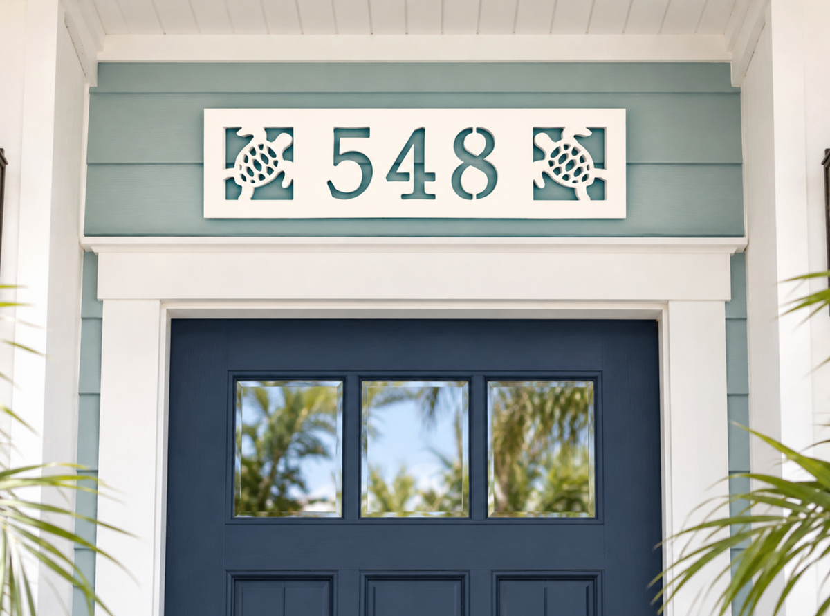 coastal house number sign with two sea turtles